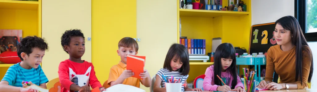 Children in a Westerville daycare classroom with a teacher at The Learning Academy